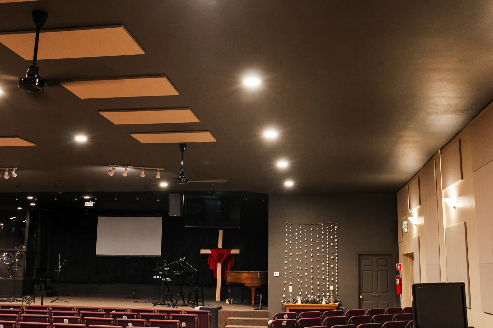 Full sanctuary view lit by ceiling panel lighting